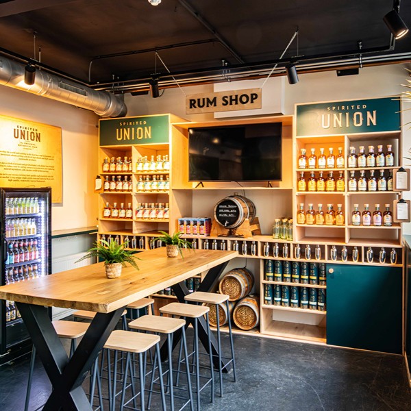 The Distillery - Rum shop with seating table
